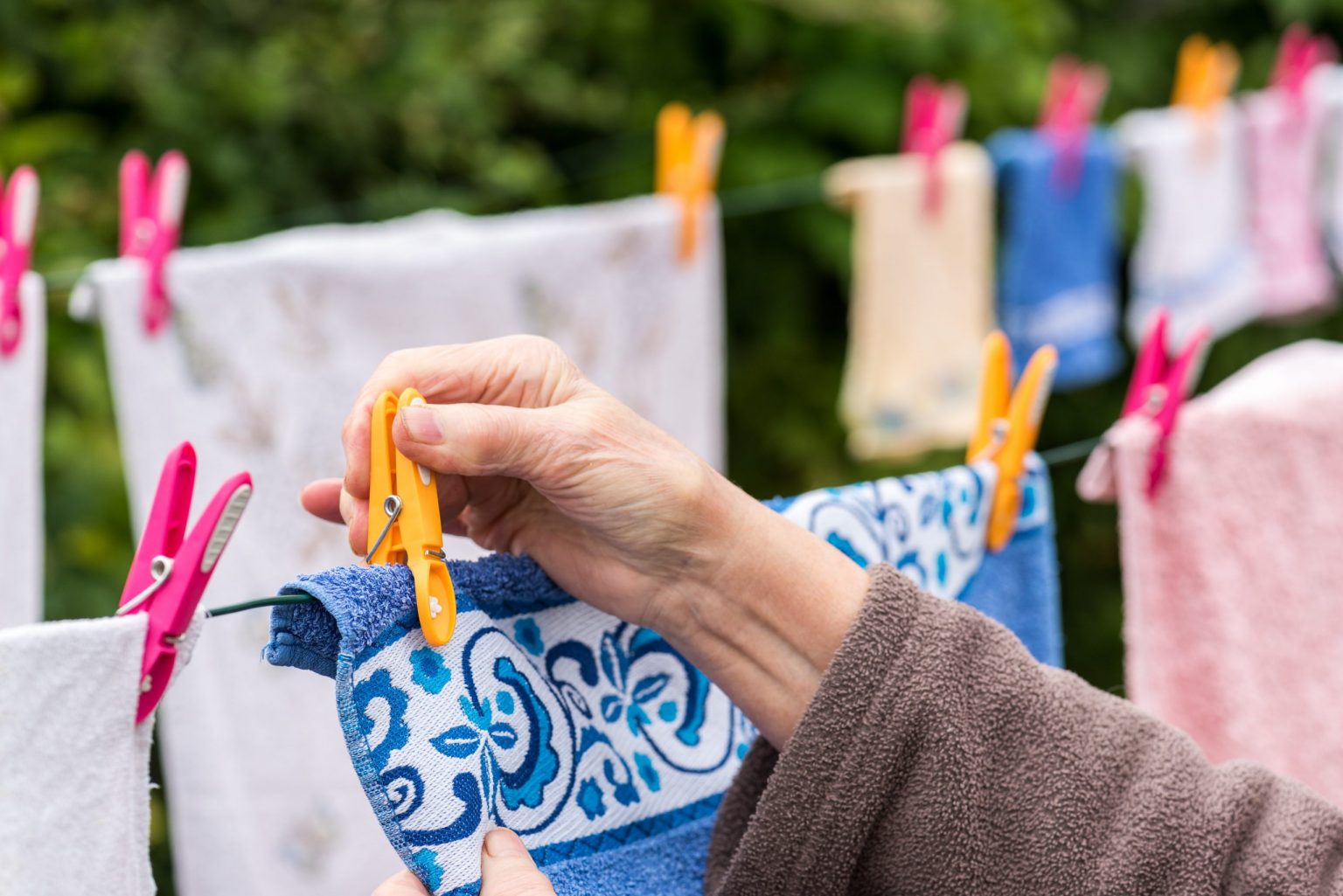woman hanging laundry outdoor
