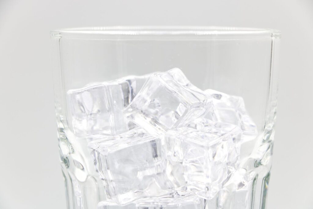 Clear ice cubes in a drinking glass