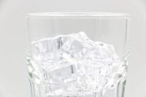 Clear ice cubes in a drinking glass
