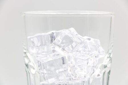 Clear ice cubes in a drinking glass