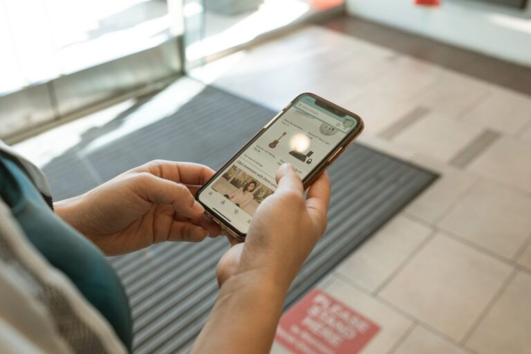 Hands holding a smartphone with an online shopping app open